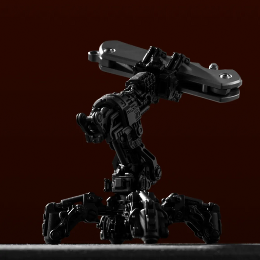 Blackened Mechanical Arm Figurine hero sculpture on a dark red background