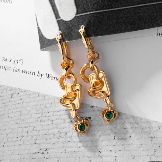 Wild Card Earrings gold-finish pair flat lay