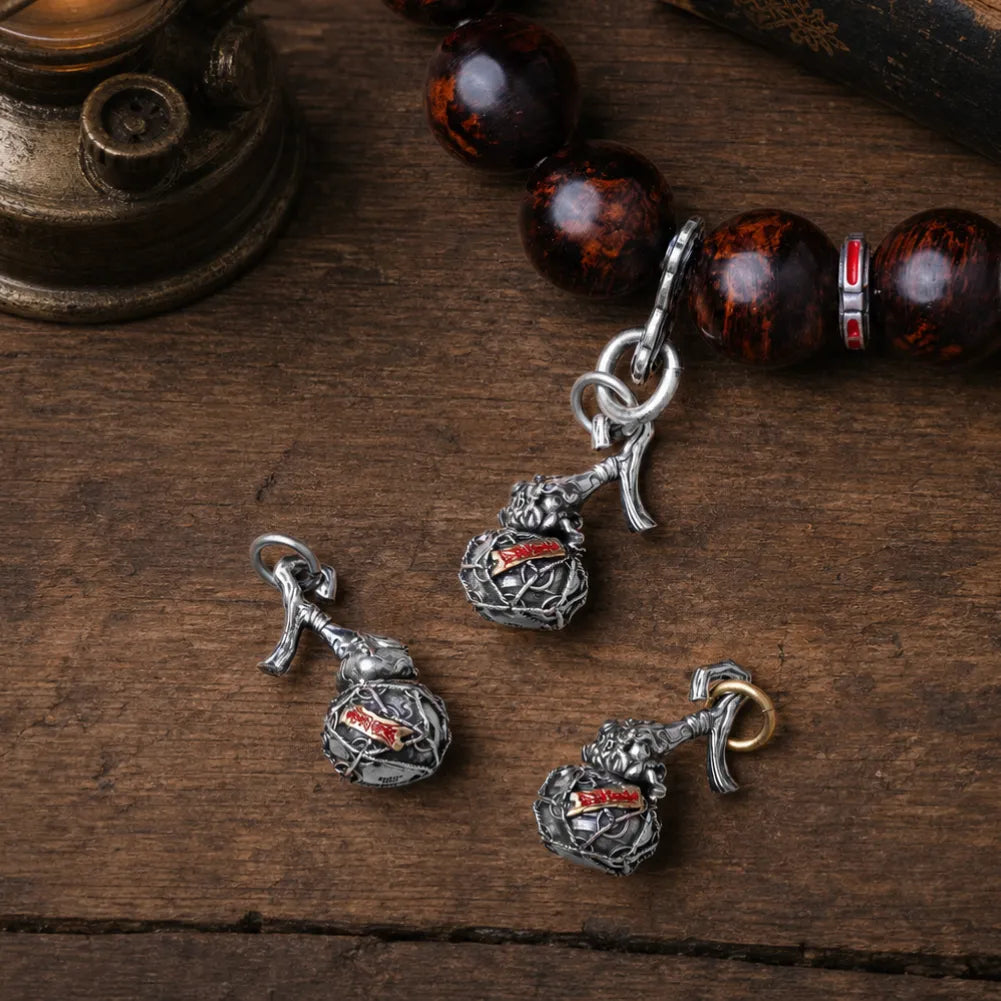 Trickster Gourd Charm Cinnabar Charm Flat Lay