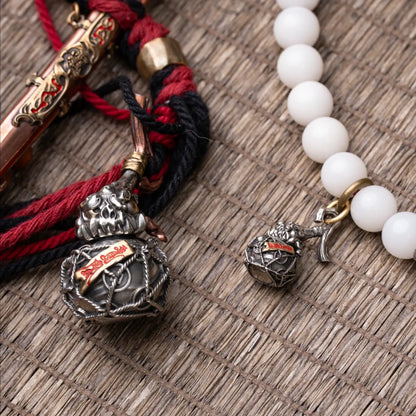 Trickster Gourd Charm With Cinnabar Beads Flat Lay