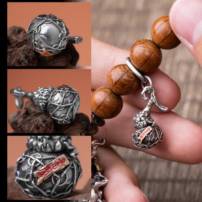 Trickster Gourd Charm Engraved Details Close Up