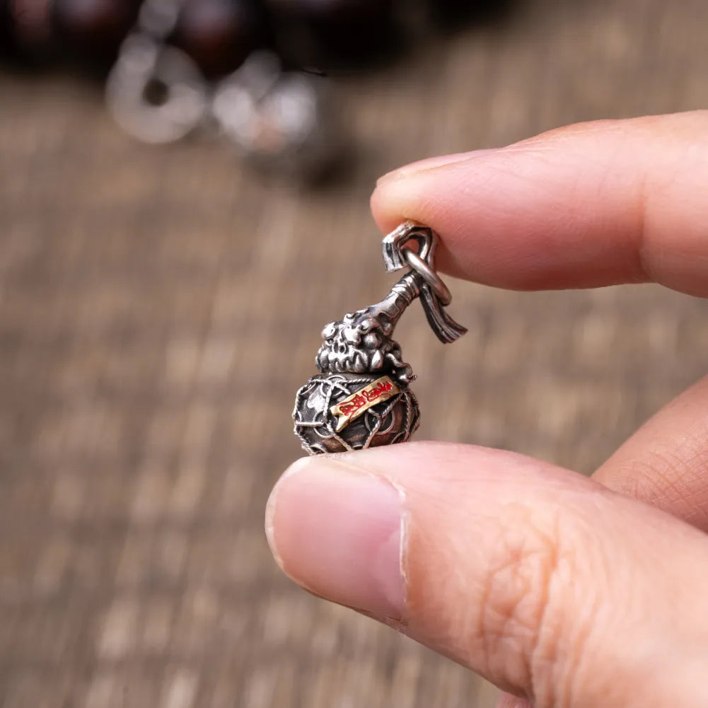 Trickster Gourd Charm Finger Held Size View