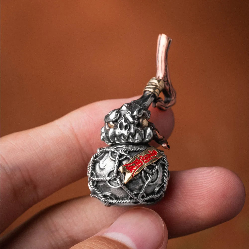 Trickster Gourd Pendant Handheld Close Up