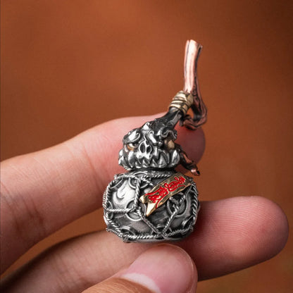 Trickster Gourd Pendant Handheld Close Up