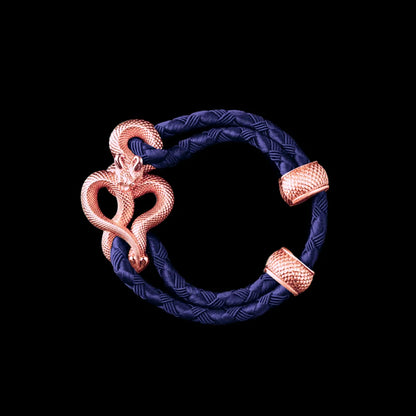 Demon Serpent Rope Bracelet 18K Rose Gold 4mm Braided Rope Vivid Blue Black Background
