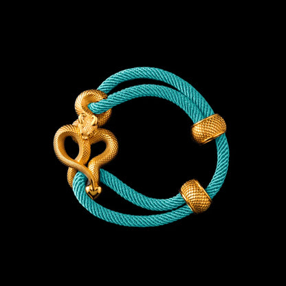 Demon Serpent Rope Bracelet 24K Gold 4mm Milan Rope Light Blue Black Background