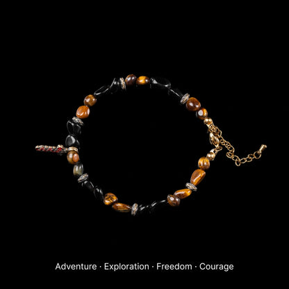 Lightseeker Bracelet obsidian tiger eye and coin sword charm black background product view