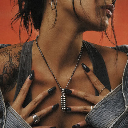 Polished White Bronze Rattlesnake Tail Pendant on female model 02