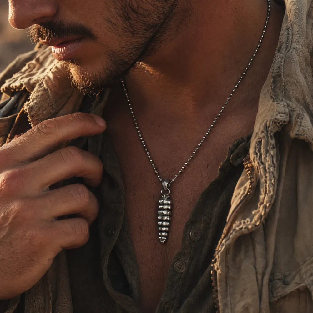 Polished White Bronze Rattlesnake Tail Pendant on male model 01