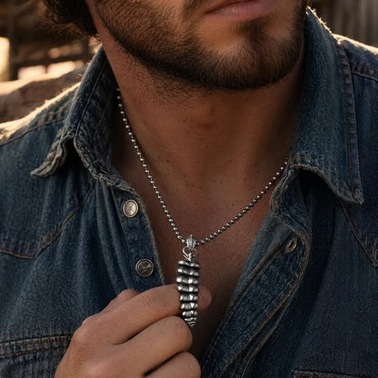 Polished White Bronze Rattlesnake Tail Pendant on male model 02