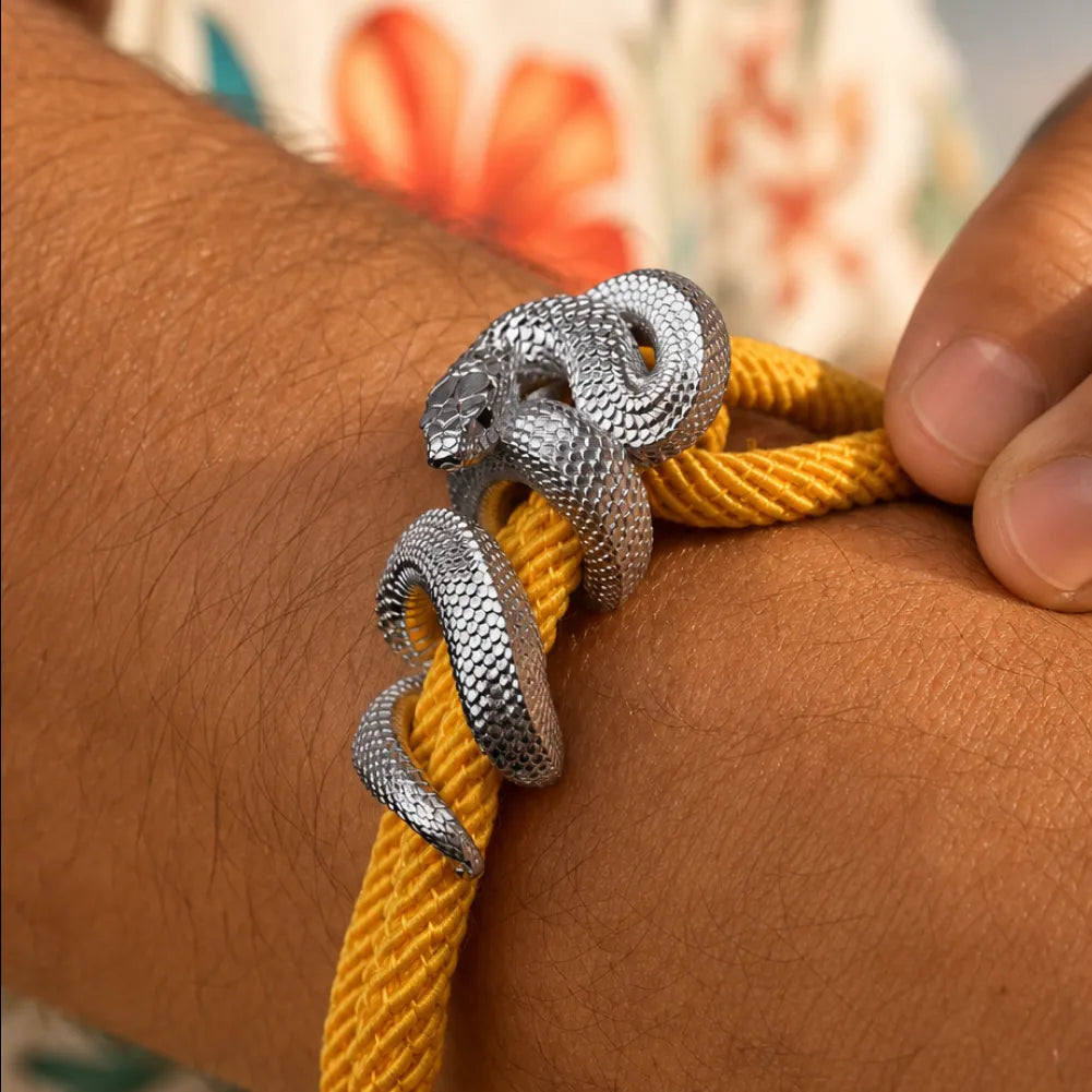 Black Mamba Rope Bracelet in 18K White Gold Plated White Bronze, cord adjustment and snake clasp shown close up on the wrist.