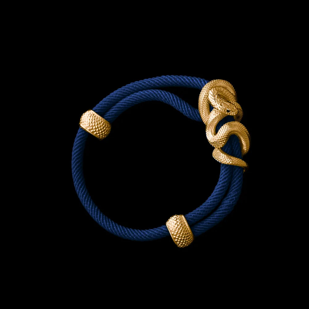 Black Mamba rope bracelet in 24K Gold Plated Brass with 4mm Milan Rope and Navy Blue cord, black-background variant view