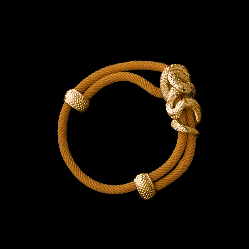 Black Mamba rope bracelet in 24K Gold Plated Brass with 4mm Milan Rope and Ochre cord, black-background variant view