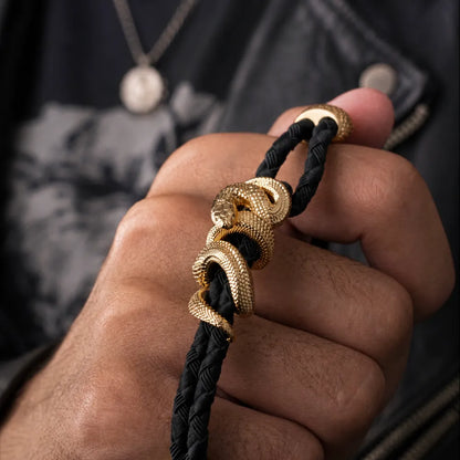 Black Mamba Rope Bracelet in 24K Gold Plated Brass, worn on the wrist in a lifestyle close-up.