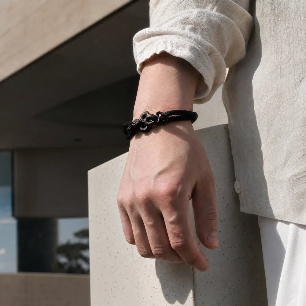 Blackened Black Mamba rope bracelet styled with a neutral shirt