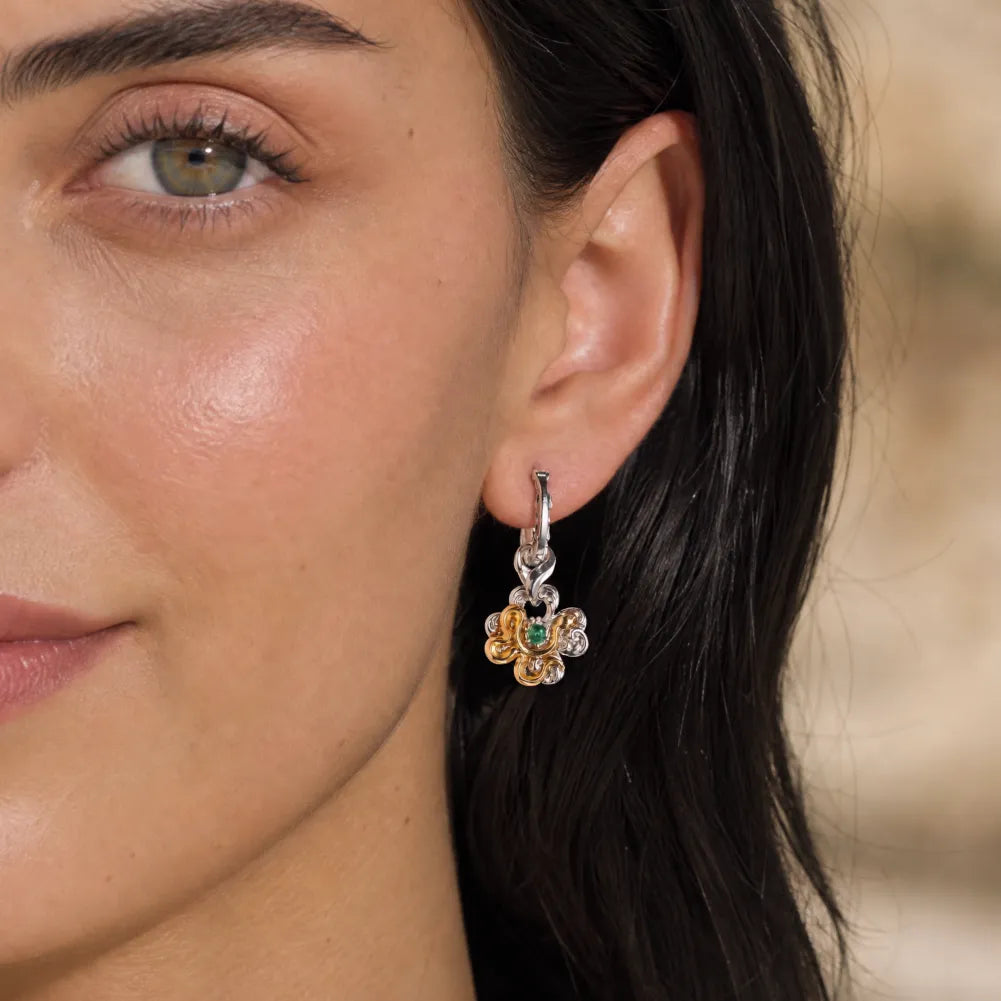 Clover serpent single earring worn by a female model