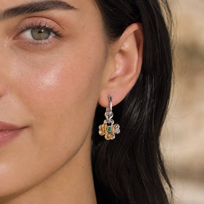 Clover serpent single earring worn by a female model