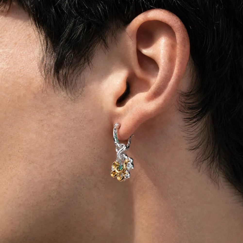 Clover serpent single earring worn by a male model