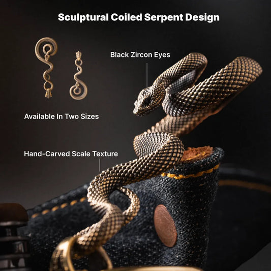 Sculptural coiled serpent keychain design with black zircon eyes and hand-carved scales
