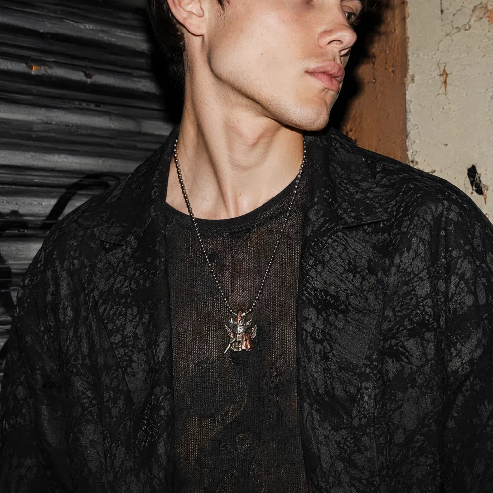 Crimson Templar pendant necklace styled with a black jacket