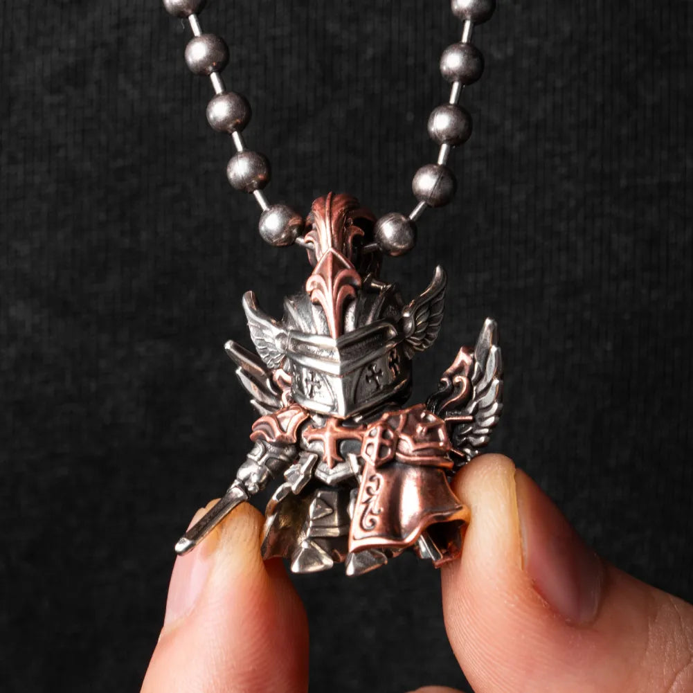 White bronze and copper Crimson Templar pendant held in hand