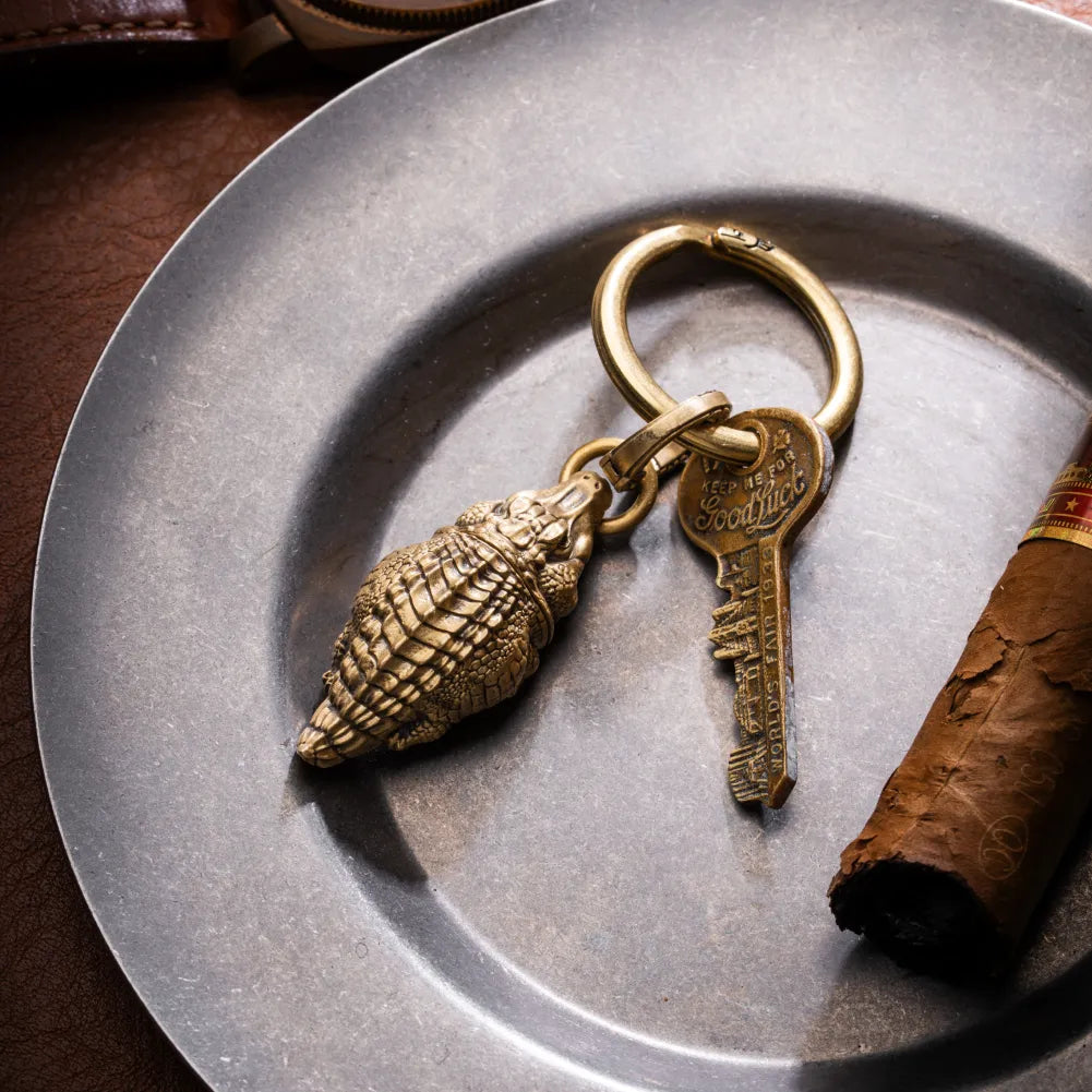 Crocodile pendant and a key attached to a round key ring.