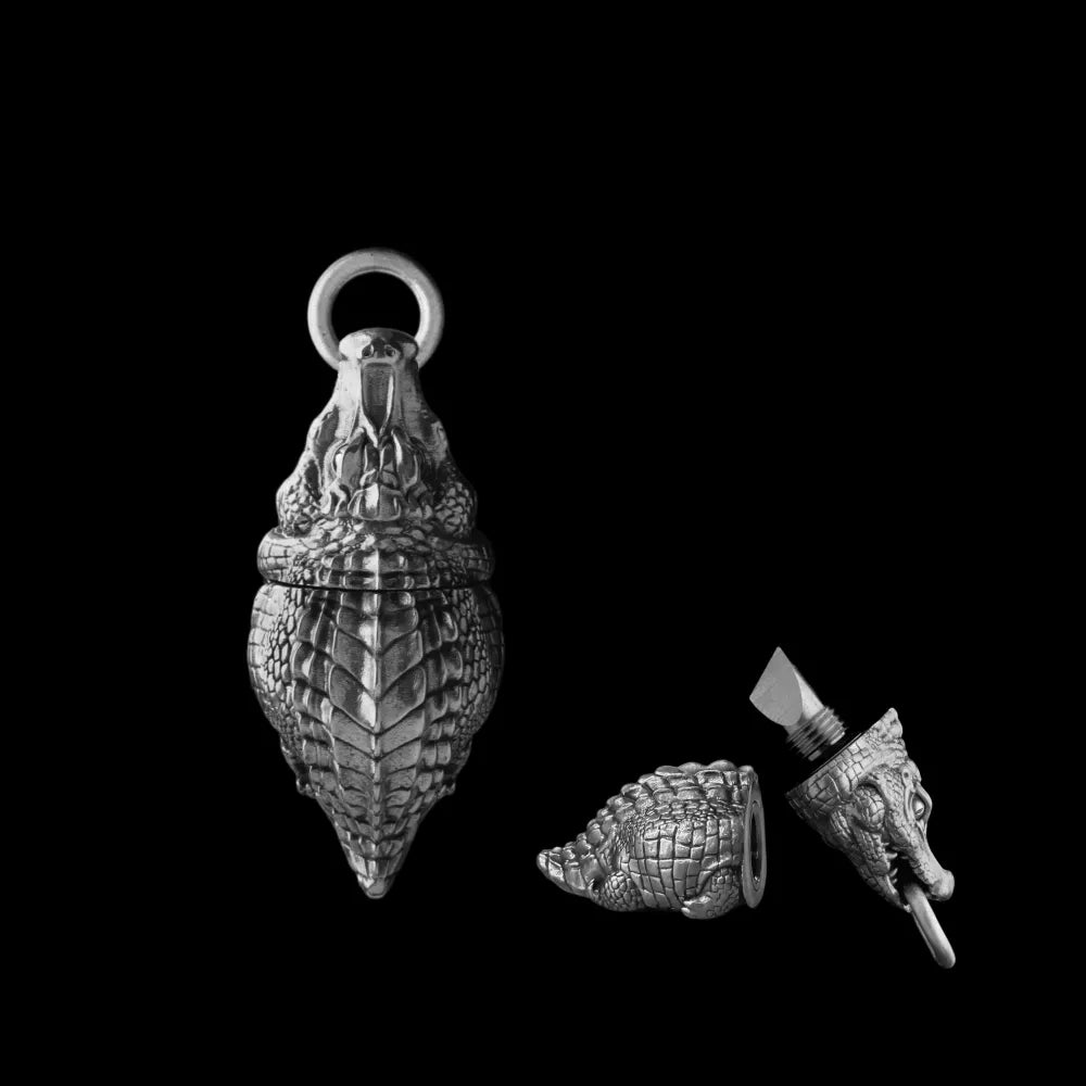 Crocodile box opener pendant in dark silver tone.