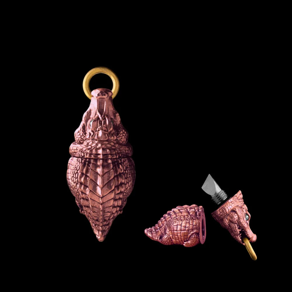 Crocodile box opener pendant in mixed metallic tones.