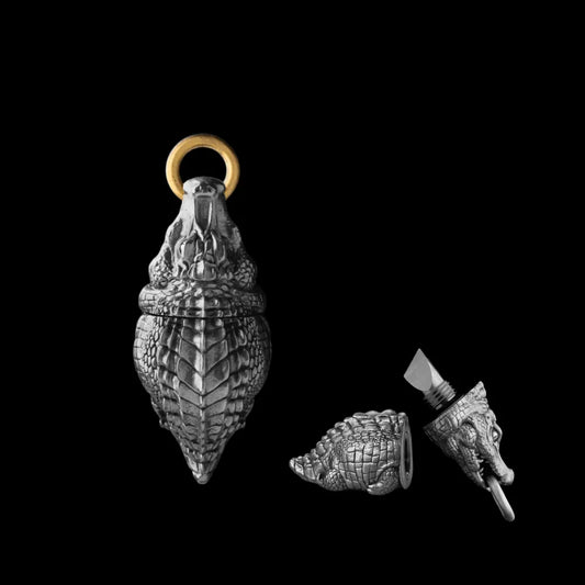 Crocodile box opener pendant shown closed and open, with a gold-tone ring.