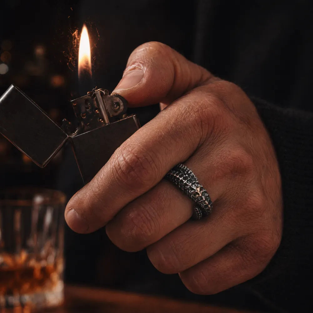 Man wearing the Dragon Scale Ring 2.0 while holding a lighter