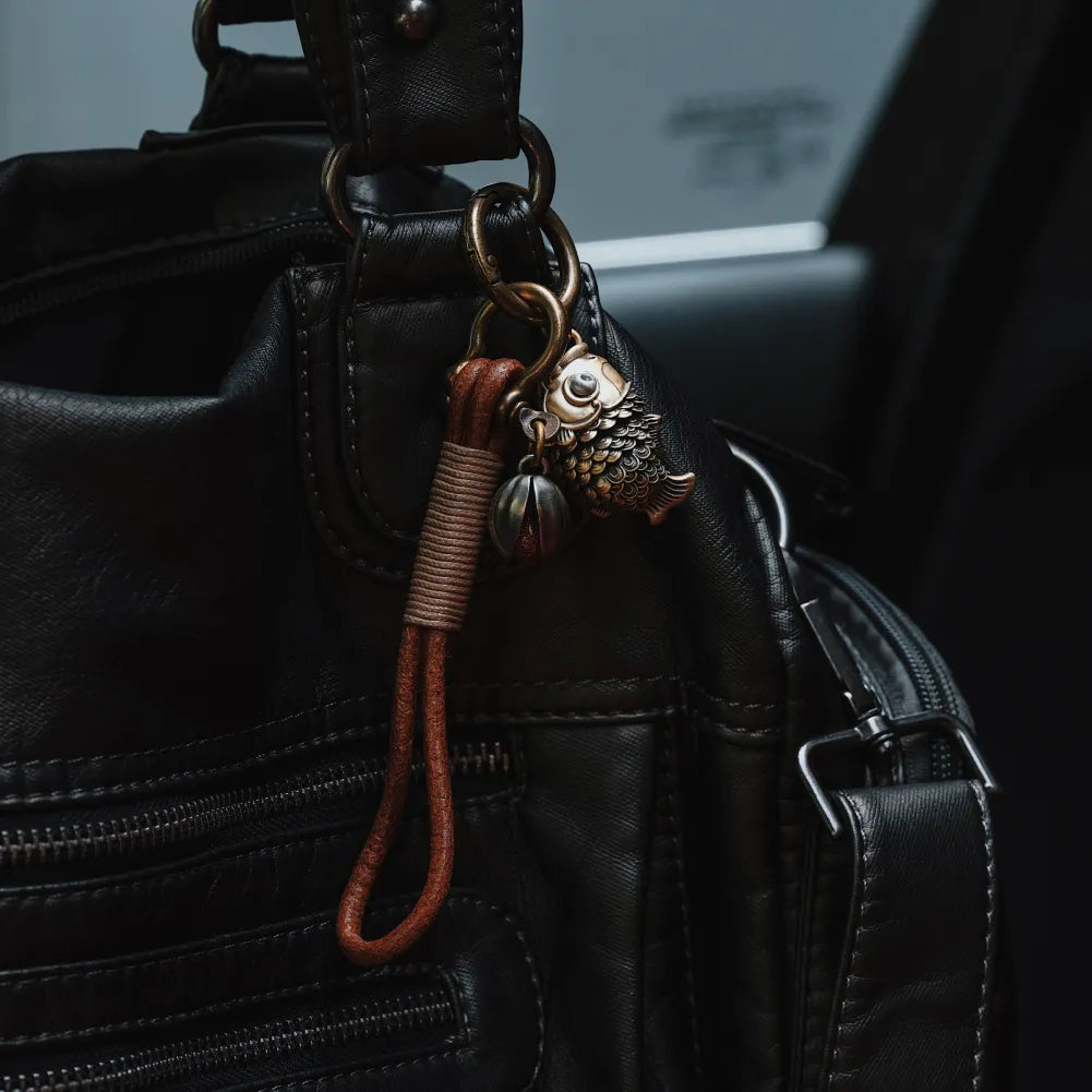Koi fidget pendant used as a bag charm