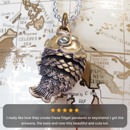 Koi fidget pendant displayed with a customer testimonial
