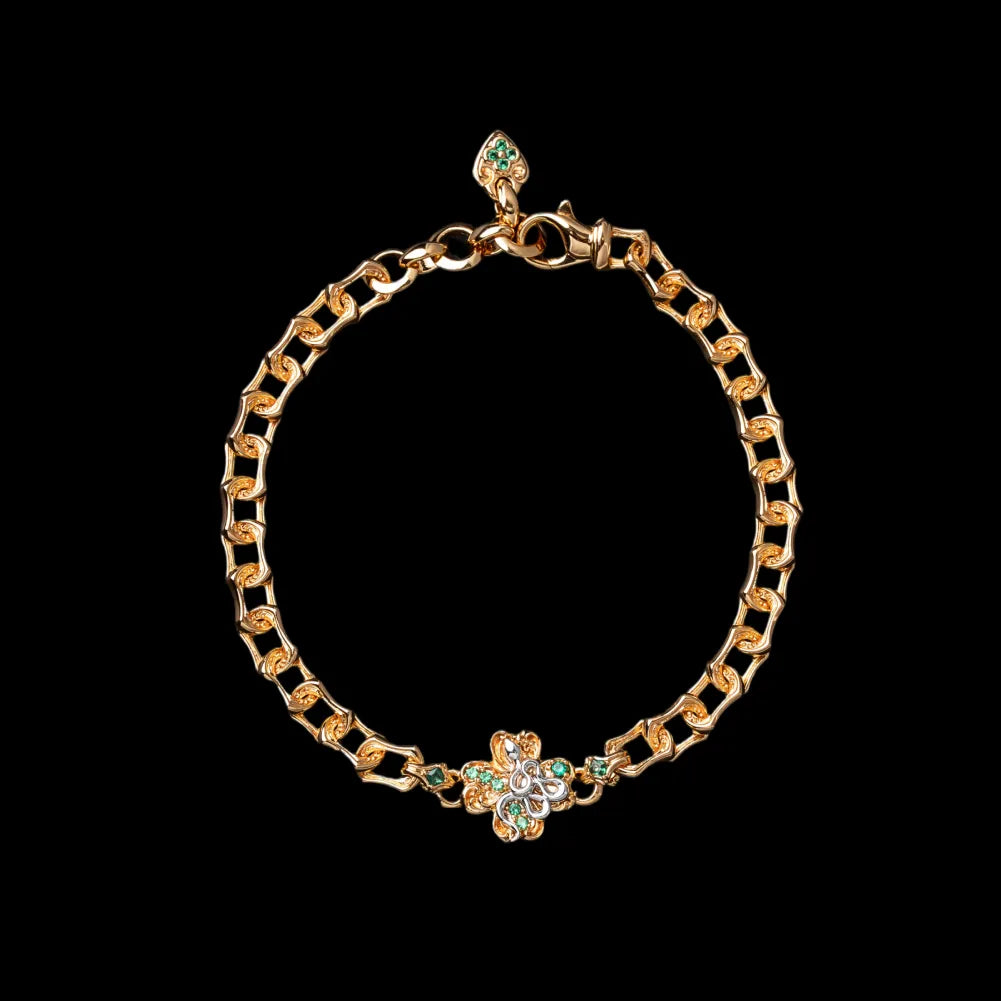 Gold-tone Lucky Clover Snake Bracelet on a black background