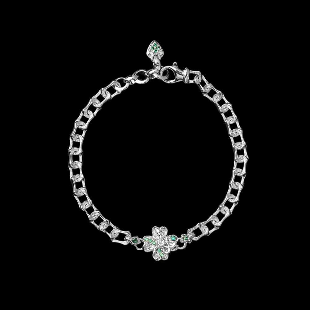 Light-tone Lucky Clover Snake Bracelet with green clover details on a black background