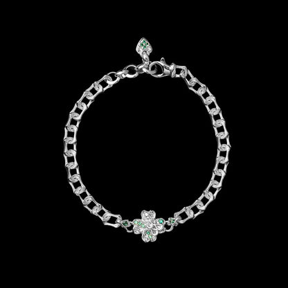 Light-tone Lucky Clover Snake Bracelet with green clover details on a black background