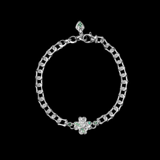 Light-tone Lucky Clover Snake Bracelet with green clover details on a black background
