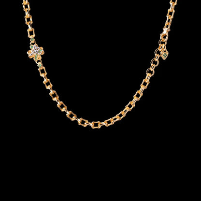 Lucky Clover Snake Necklace in 24K gold-plated brass and 18K white gold-plated brass; necklace only