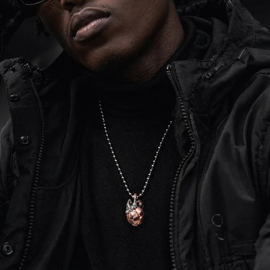 Copper & White Bronze Mechanical Heart Pendant worn as a statement necklace in a lifestyle portrait