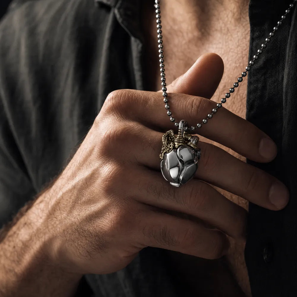 White Bronze & Brass Mechanical Heart Pendant worn in a men's lifestyle scene