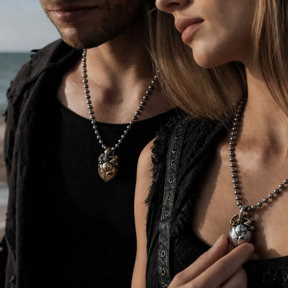 White Bronze & Brass Mechanical Heart Pendant styled in a close-up fashion portrait