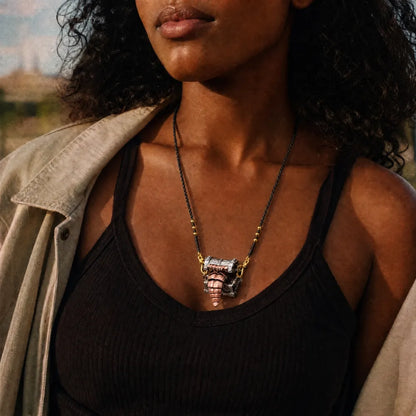 White bronze and copper Mimicling Chest Pendant necklace worn with a black top