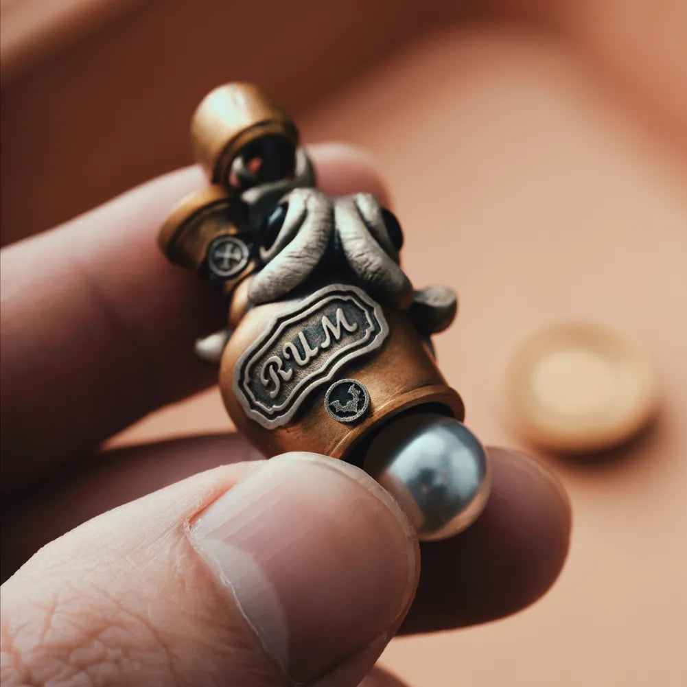 Octopus capsule pendant held in hand in a front view
