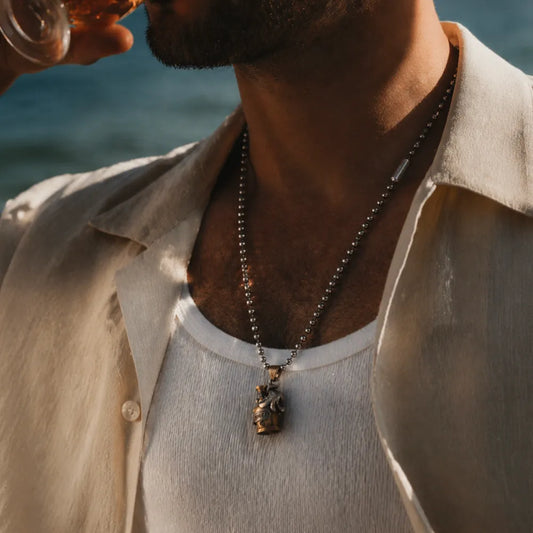 Man wearing an Octopus capsule pendant with a tank top