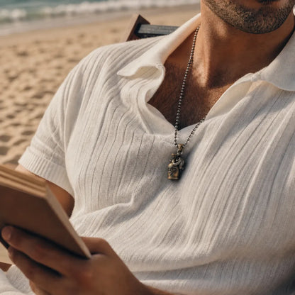 Man wearing an Octopus capsule pendant with a white shirt
