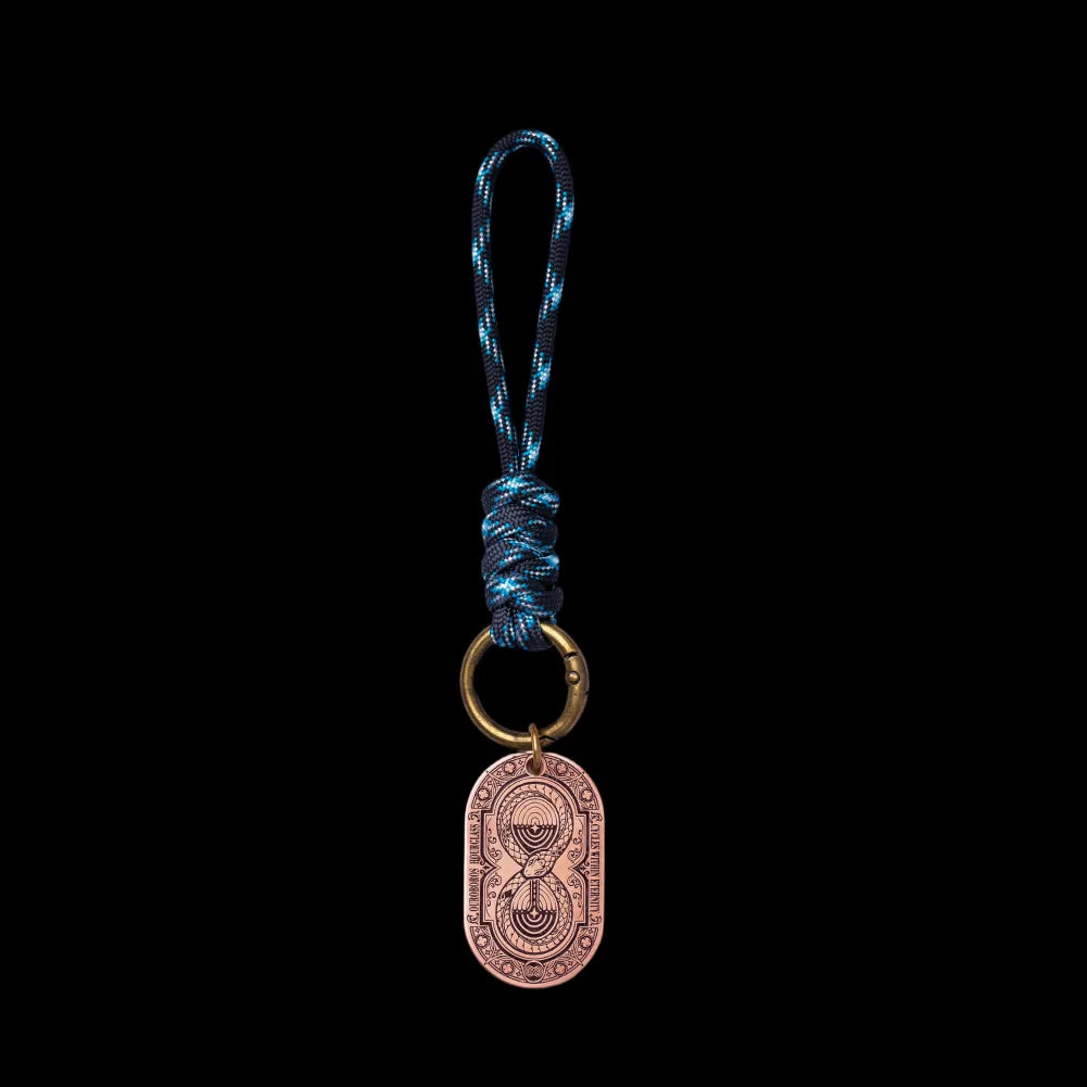Ouroboros Hourglass Tag SKU image 2 in gold-tone finish; attachment examples are not included