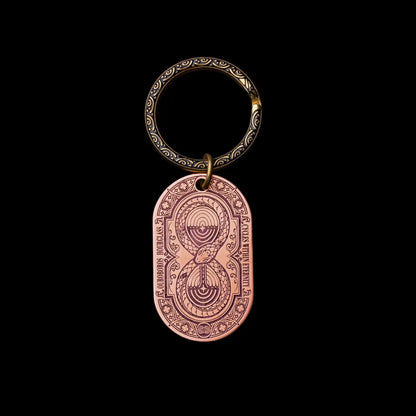 Ouroboros Hourglass Tag SKU image 4 in gold-tone finish; attachment examples are not included