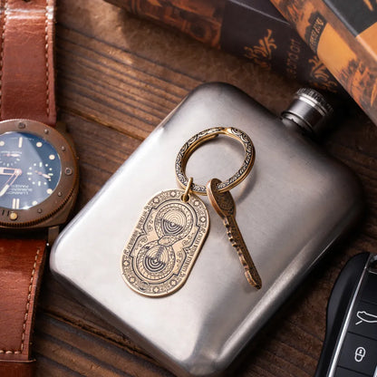 Ouroboros Hourglass Tag product view 1; any visible attachment is an example