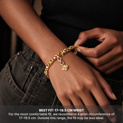 Gold-tone Ouroboros Infinity Bracelet worn on a wrist, with a recommended wrist circumference of 17 to 19.5 cm