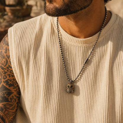 Owl fidget pendant styled as a long necklace for men