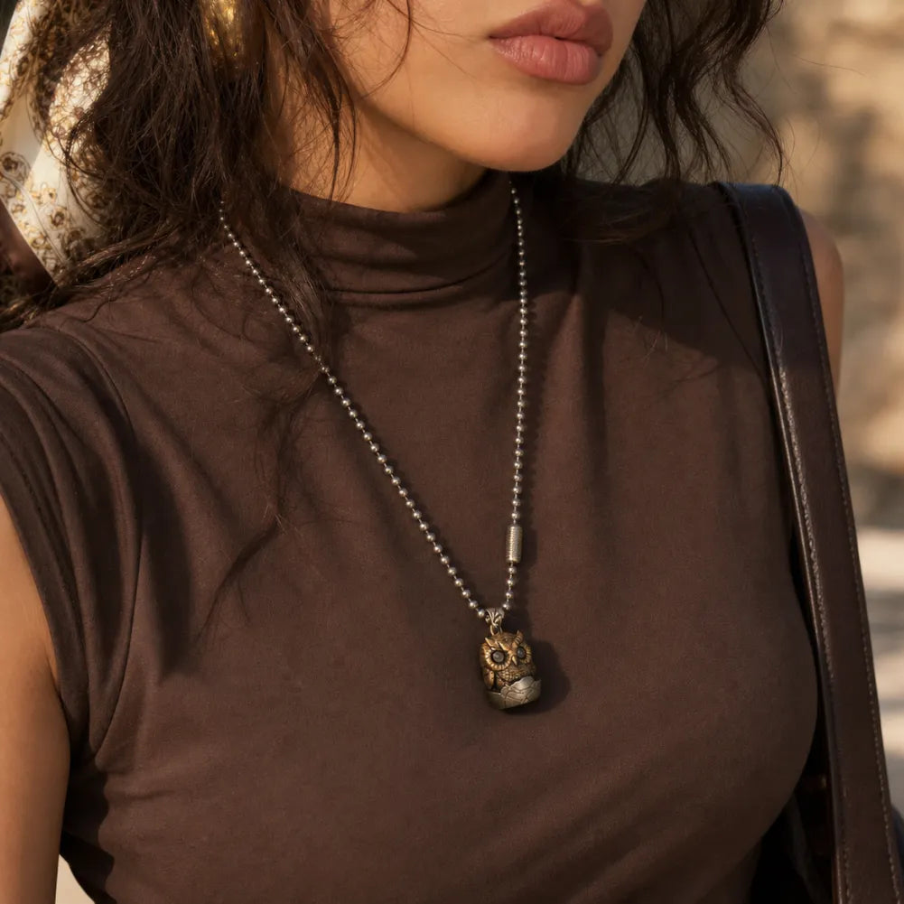 Owl fidget pendant styled as a long necklace for women